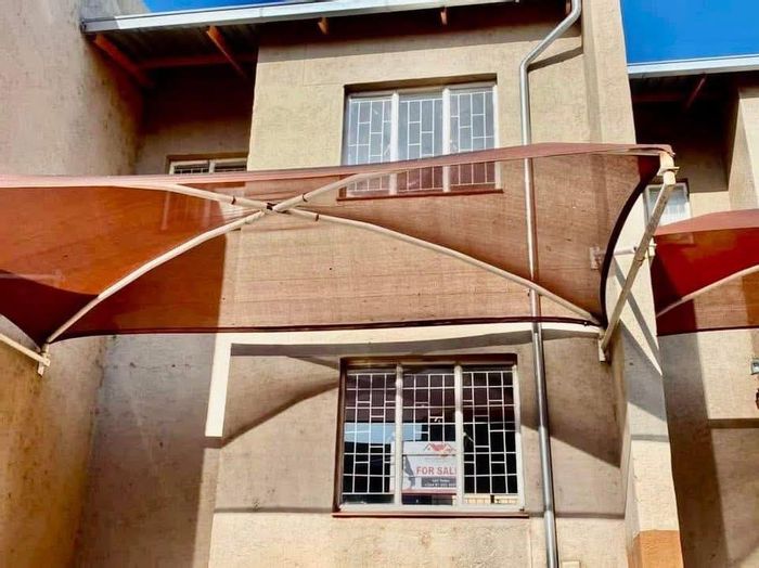 For Sale: Townhouse in Katutura with 2 bedrooms, carport, and private courtyard.