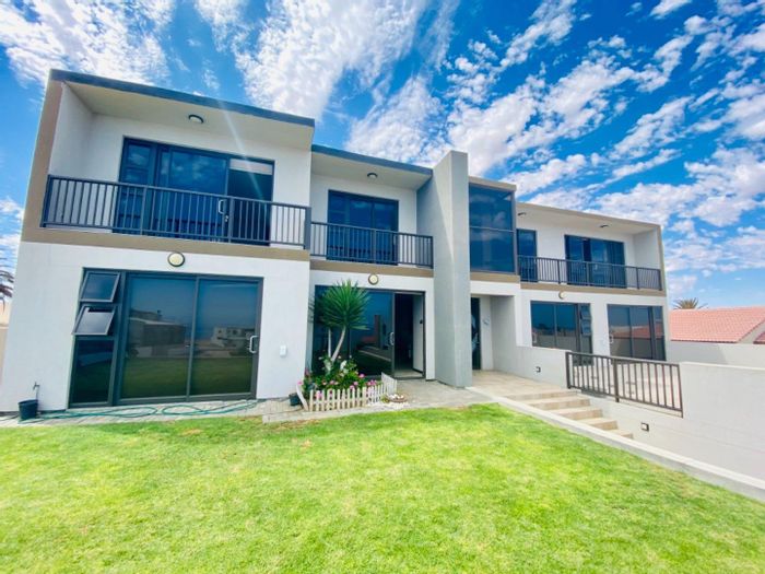 Dolphin Beach House For Sale: Spacious with sea views, gardens, and expansion potential.