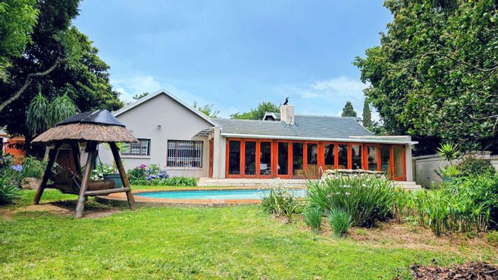 Spacious Bryanston East house with pool, gardens, and multiple parking options for sale.