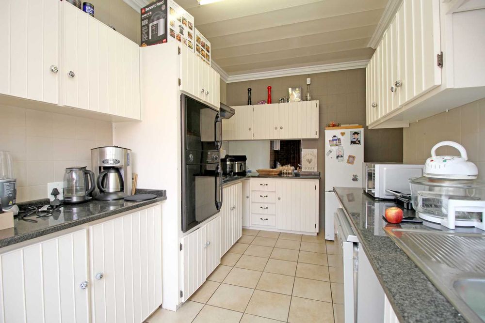 KITCHEN CABINETS ARE ALL WHITE WITH GREY TONES