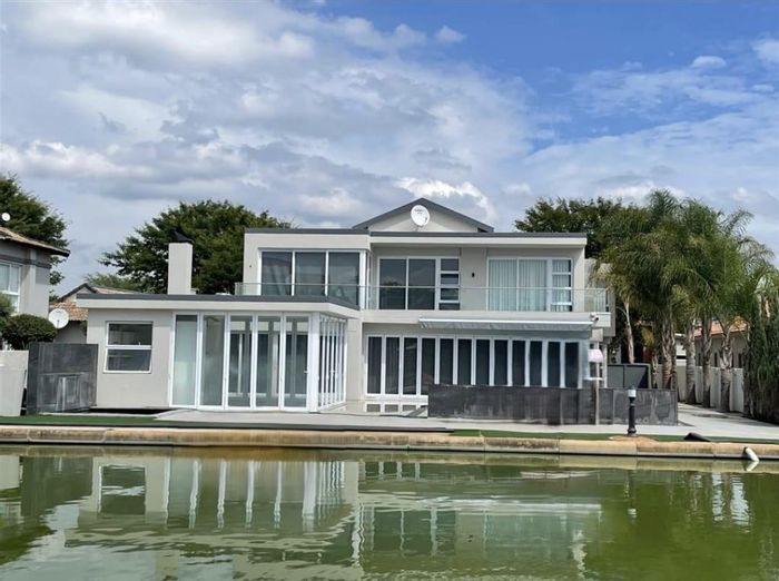 Canal-front house for sale in The Islands Estates with pool and flatlet.