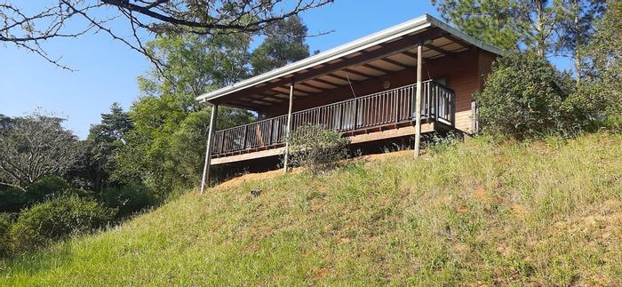 Drummond Small Holding For Sale: Two cottages, natural wells, and development potential.