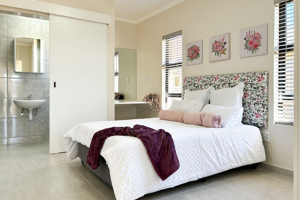 Main bedroom with built-in cupboards & ensuite.