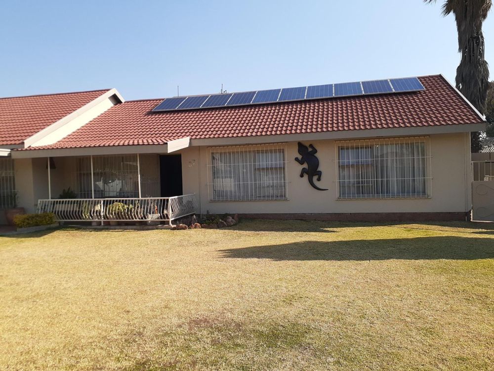 front of house with solar panels on roof