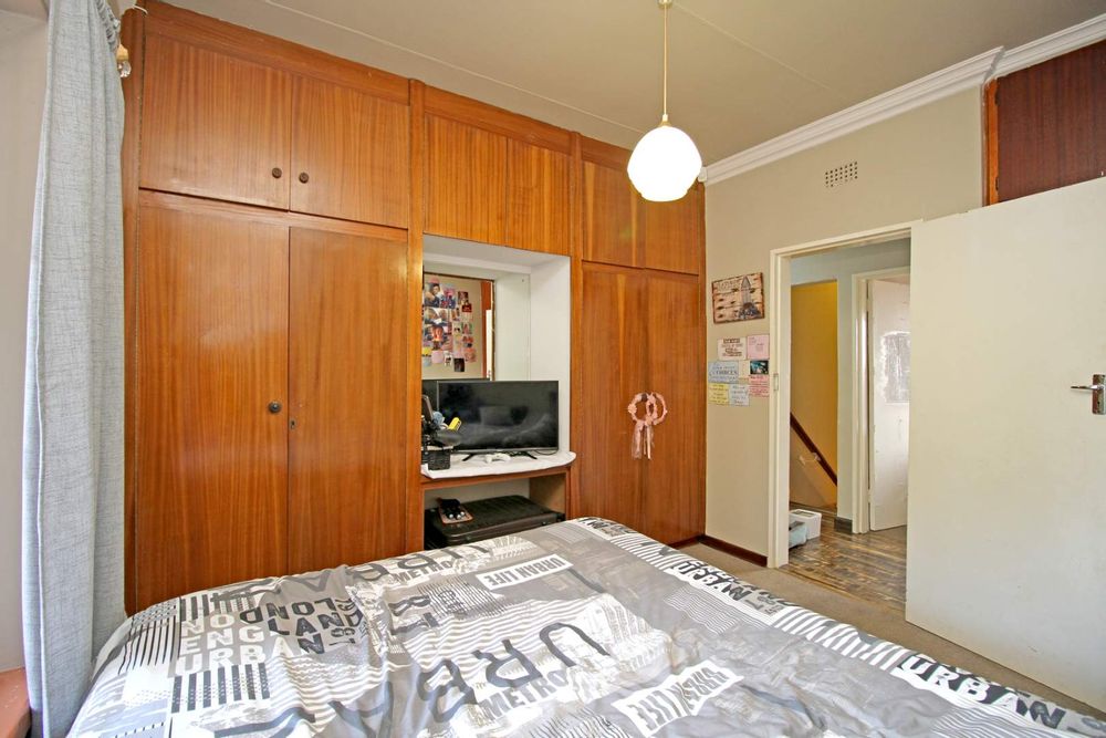 FAMILY BEDROOM NO. 1 WITH BUILT-IN CUPBOARDS AND VANITY