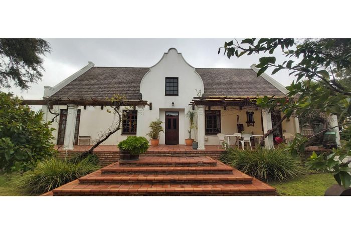 For Sale: House in Stellenberg with garden cottage, spacious living areas, and serene outdoor spaces.