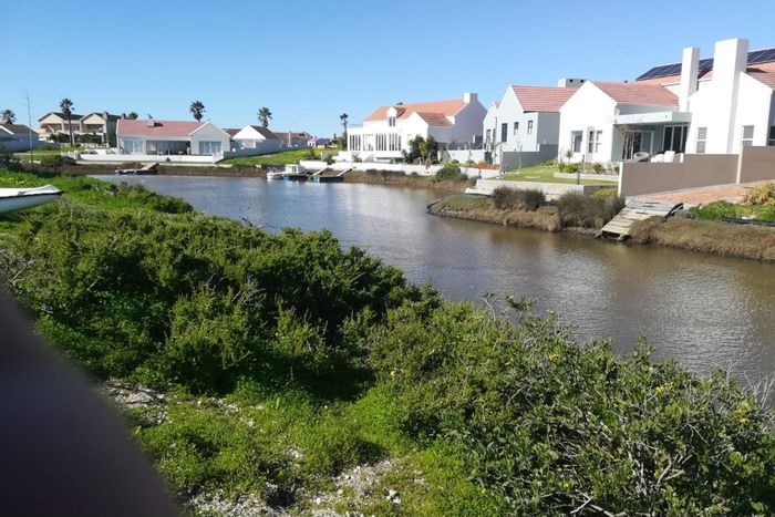 Waterfront vacant land for sale in Port Owen, with plot and plan options.