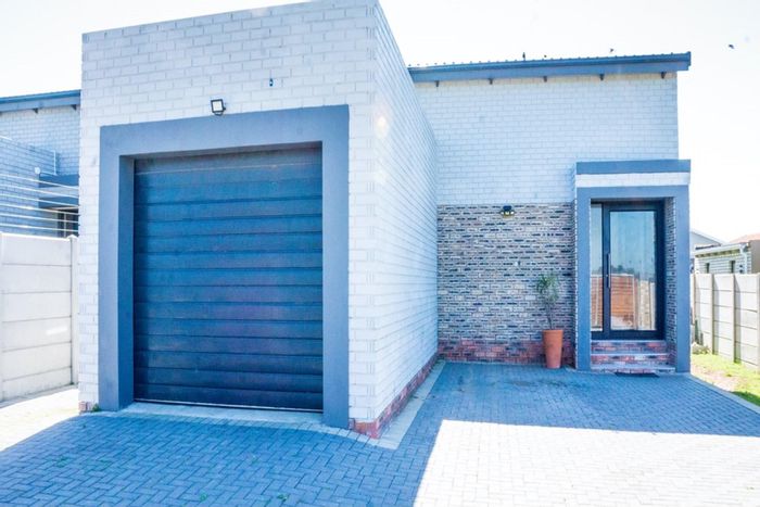 For Sale: House in Overbaakens with 3 bedrooms, outdoor braai, and security features.