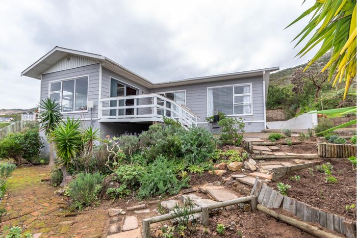 For Sale: Glencairn Heights house with ocean views, spacious kitchen, and garden.