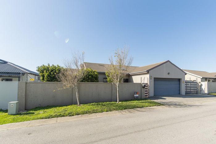 For Sale: Pinelands House with double garage, braai area, and water tanks.