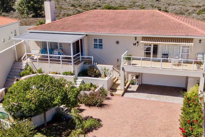 For Sale: House in Port Owen with marina views, braai area, and solar panels.