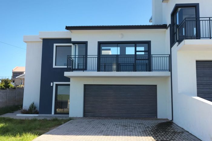 For Sale: House in Dana Bay with ocean views, garage, and open-plan living.