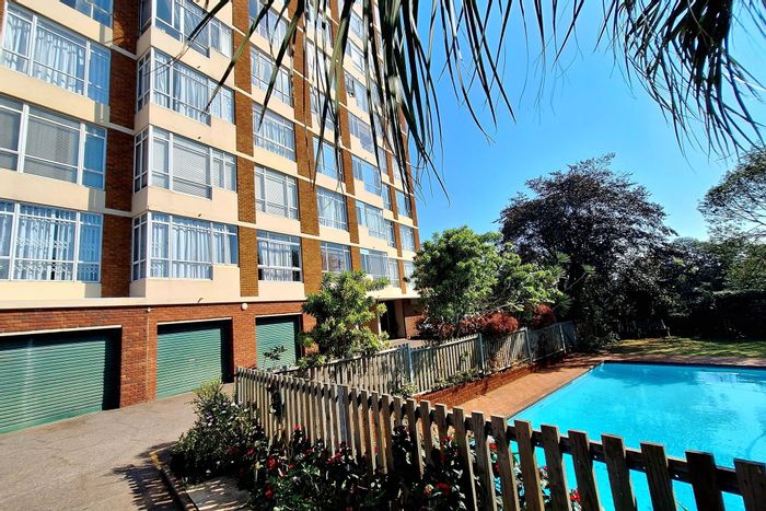 Bulwer Apartment For Sale: Sea views, pool, garage, and open-plan living space.