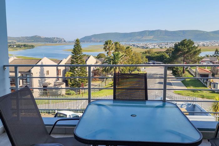 For Sale: Apartment in Old Place with lagoon views, garage, and communal rooftop area.