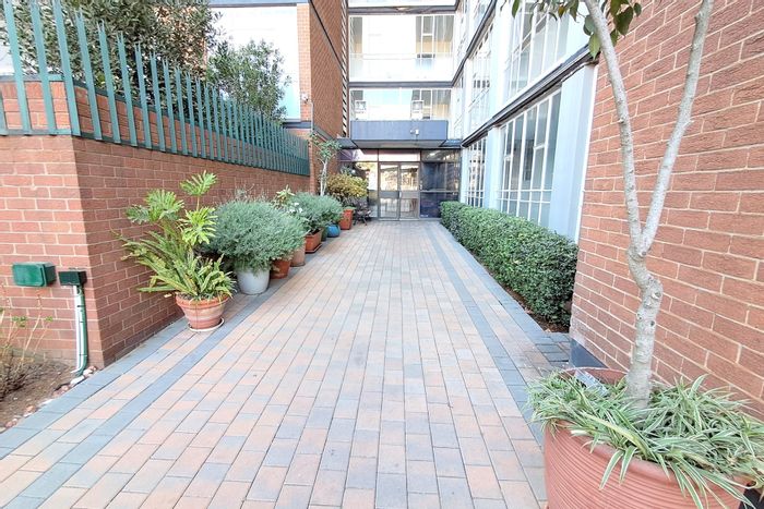 For Sale: Spacious Bedford Gardens Apartment with Balcony, Garage, and Security Features.