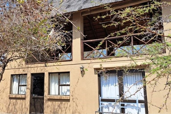 House For Sale in Marloth Park Central: 2-bed, splash pool, braai area, scenic views.