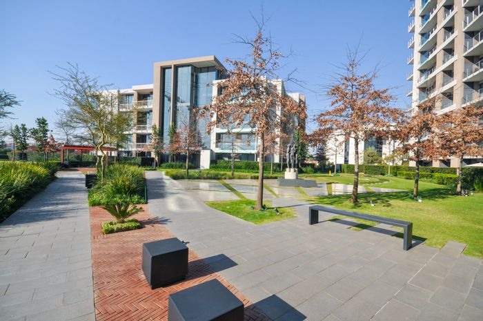 Menlyn Apartment For Sale: 2-bed, pool, rooftop dining, private garden, secure parking.