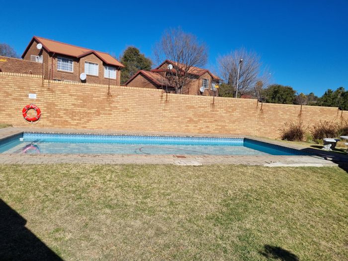 For Sale: Townhouse in The Reeds with pool, garage, and private garden.