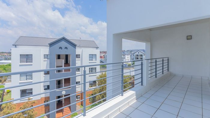 Stylish Greenstone Hill Apartment For Sale: Secure Living with Scenic Balcony Views!