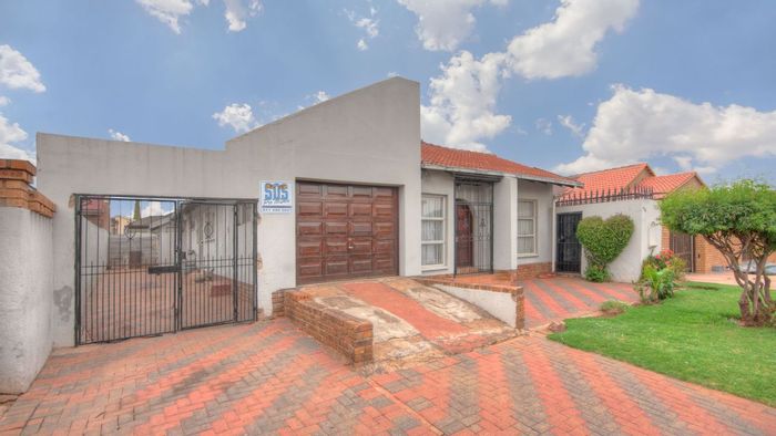 Charming 3-Bed House in Protea North with Wrap-around Garden & Garage - For Sale