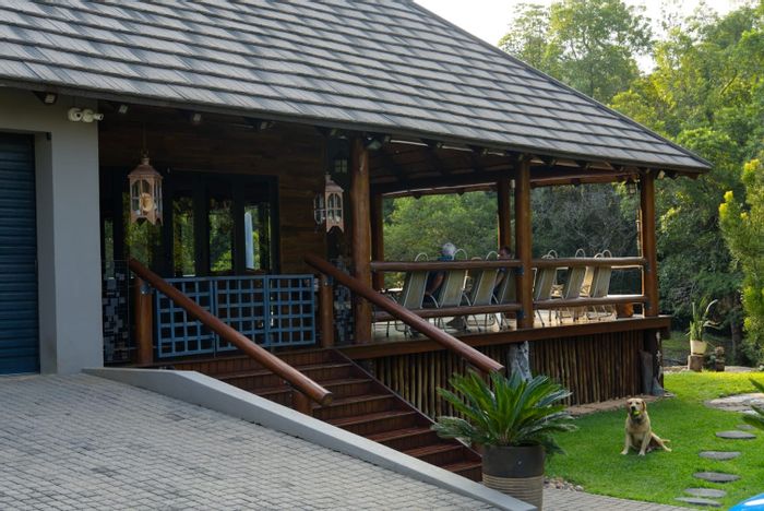 For Sale: Nelspruit Central Small Holding with two houses, cottage, and river access.