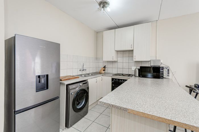 For Sale: 1BR Apartment in Grand Central with covered parking and laundry access.