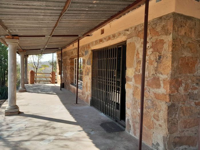 For Sale: Spacious 5-bedroom small holding in Pretoria North with greenhouses and borehole.