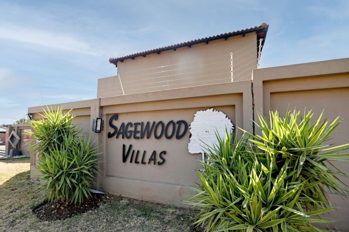 For Sale: 2-bedroom townhouse in Annlin with security, garage, and communal garden.