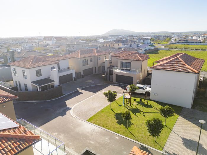 4-Bedroom House To Rent in Parklands North with security, garage, and communal garden.