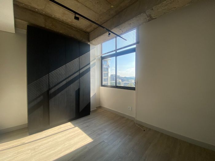 For Sale: 1-Bedroom Apartment in Sandown with Rooftop Pool and Secure Parking.