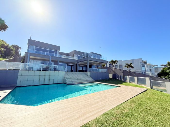 For Sale: House in Umhlanga Central with pool, bar, and guest outbuilding.