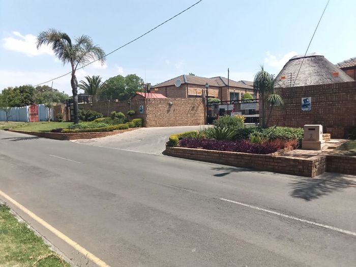 For Sale: Townhouse in Honeydew Manor with secure complex, pet-friendly garden, and double garage.