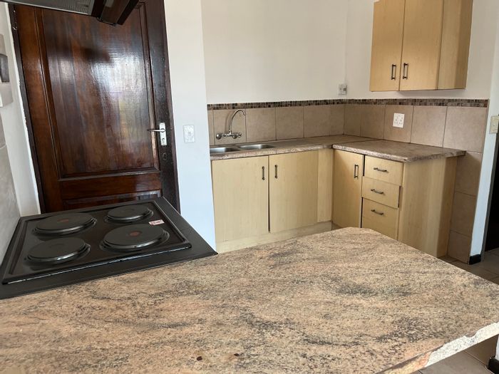 1-Bedroom Apartment for Sale in Witbank Ext 10, secure complex, parking included.