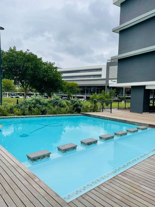 3-Bedroom Apartment To Rent in Umhlanga Ridge with pool, secure parking, and balcony.
