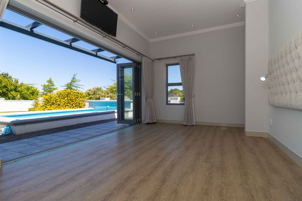 Main Bedroom opening to pool