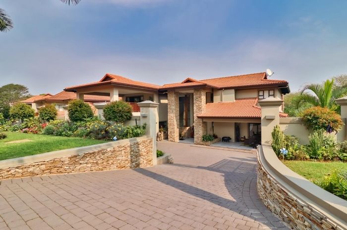 For Sale: 4-Bedroom House in Izinga Ridge with heated pool, solar power, and entertainment features.