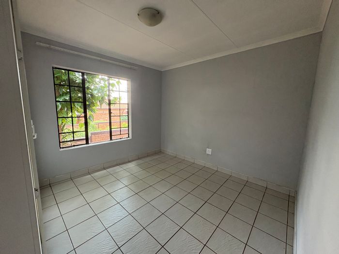 For Sale: 2-Bedroom Apartment in Weltevreden Park with private garden and secure complex.