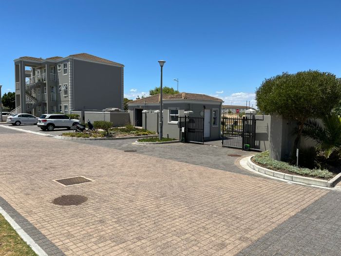 2-Bedroom Apartment To Rent in Melkbosstrand Central with parking, security, and amenities.