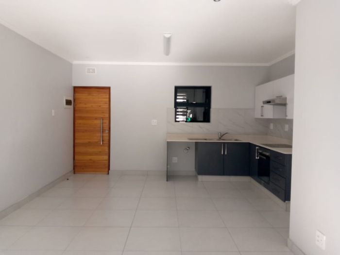 2-Bedroom Apartment To Rent in Umhlanga Ridge with pool, balcony, and parking.