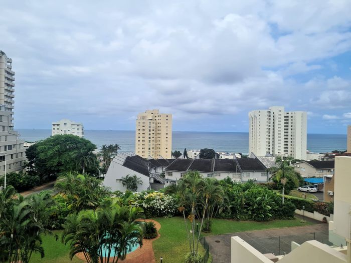 3-Bedroom Apartment To Rent in Umhlanga Central with pool, parking, and beach access.