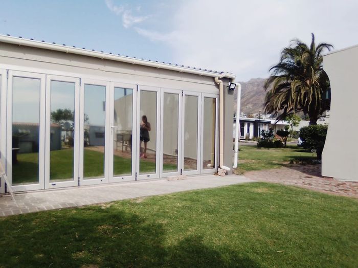 For Sale: House in Gordons Bay Central, steps to beach, dining, and entertainment.