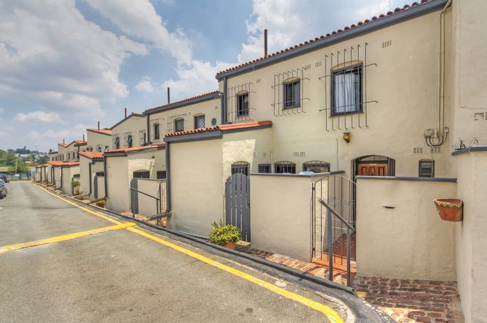 For Sale: Townhouse in Corlett Gardens with private garden, pool, and security.