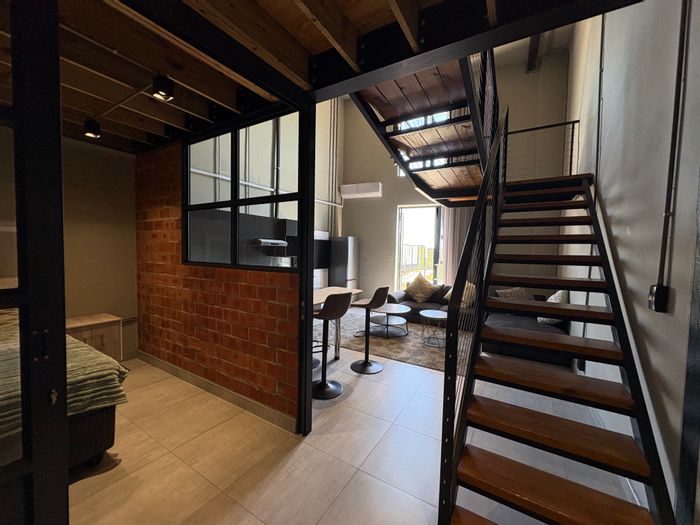 Ballito Central Apartment For Sale: Loft living above Odyssey Mall, secure amenities.