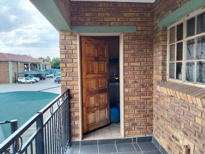For Sale: Townhouse in Modder East with 2 beds, 2 baths, prepaid utilities.