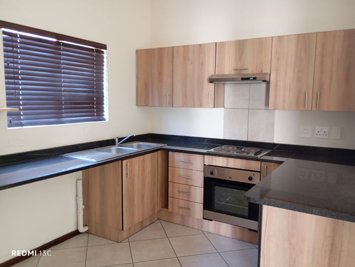 For Sale: Goedeburg Townhouse with 2 bedrooms, parking, and built-in cupboards.