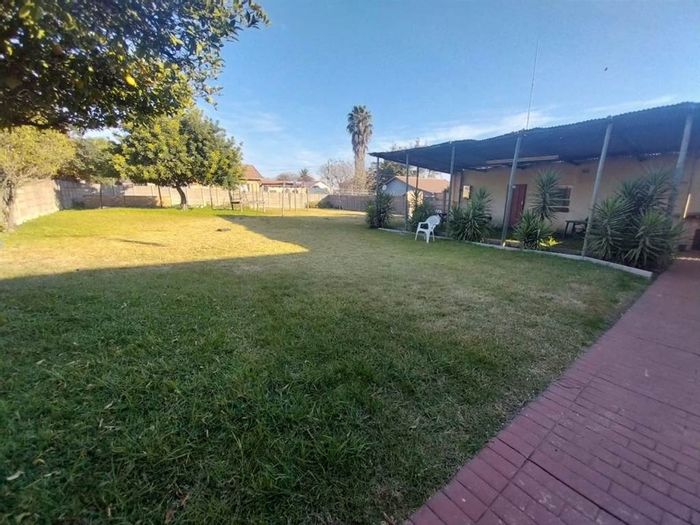 For Sale: House in Kempton Park Ext 2 with large yard and multiple rooms.