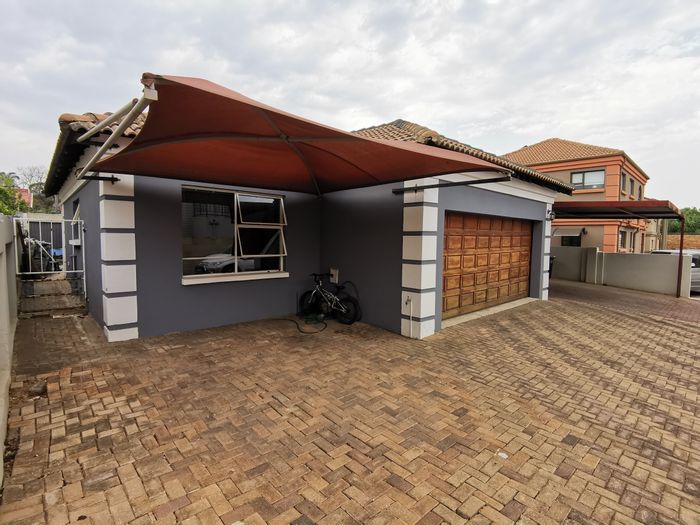 For Sale: Secure 3-bedroom house in Van Riebeeck Park with garden and garage.