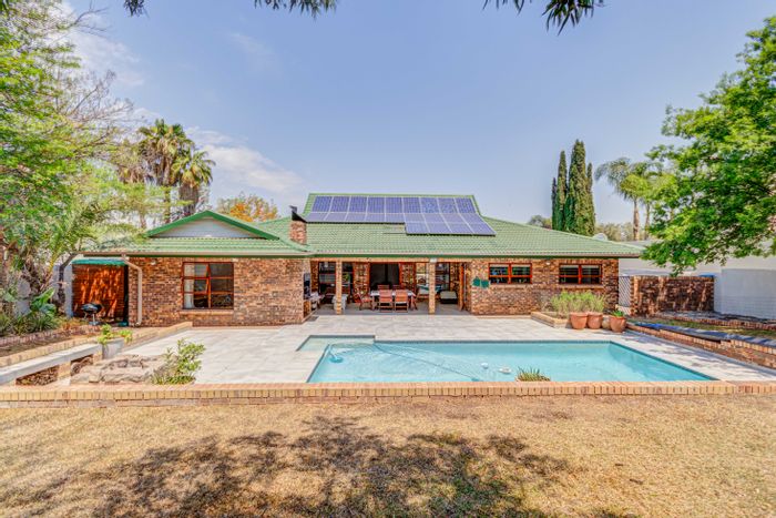 Kyalami Estates House For Sale: Spacious home with pool, solar, and park access.