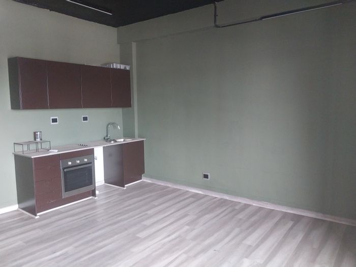 New Doornfontein Apartment For Sale: Rooftop clubhouse, restaurant, and city views.