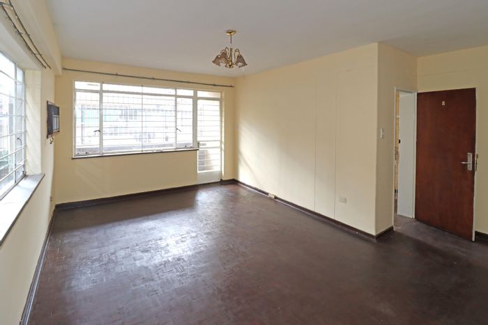 For Sale: 2-bedroom flat in Bellevue East with secure parking and enclosed veranda.